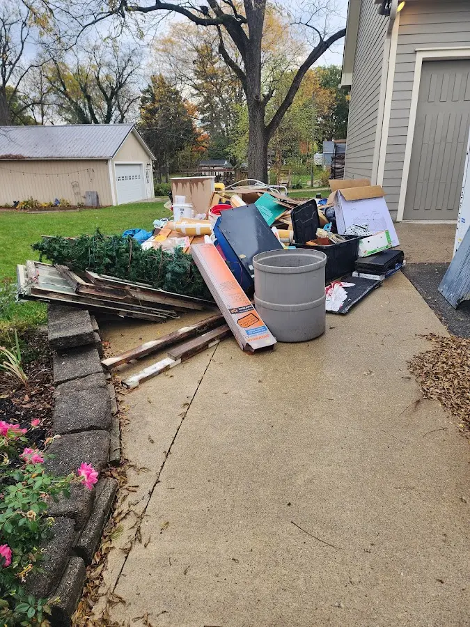 Dumpster being loaded with debris for Demolition Dumpster Rental in Brackenridge